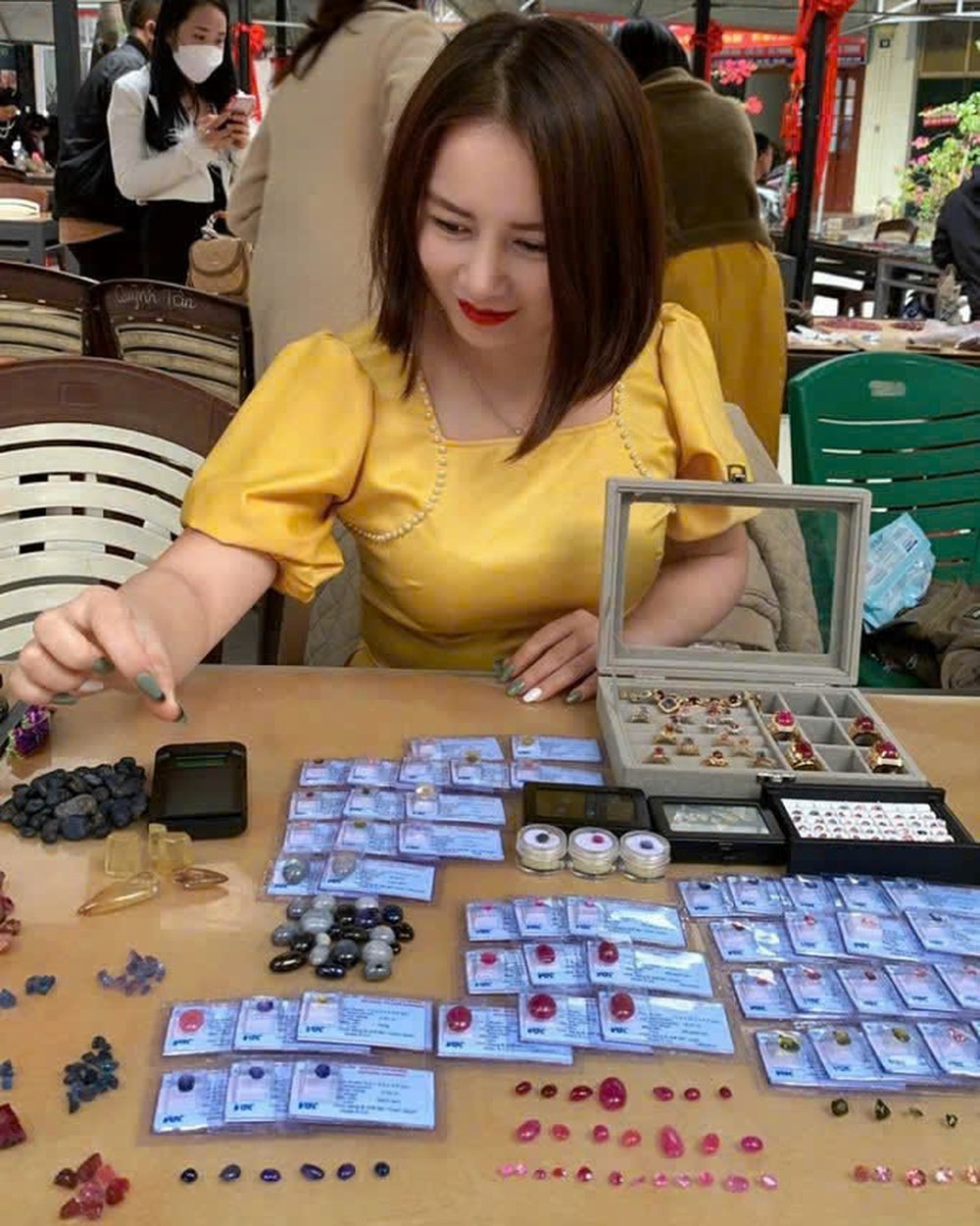 Phuong Nguyen buying gems at the Luc Yen Sunday market, Vietnam