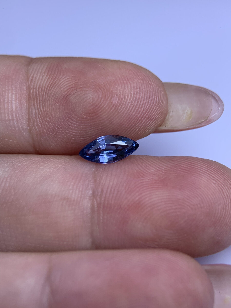 Natural blue spinel from Luc Yen held in daylight