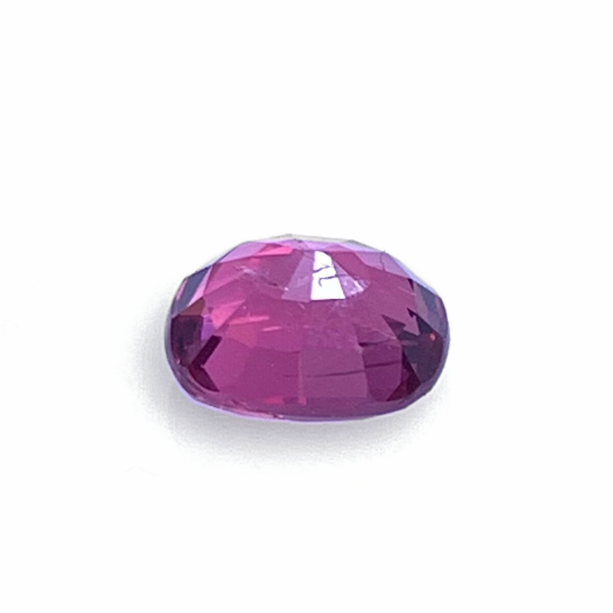 Natural vivid pinkish red spinel, pavilion view on white background