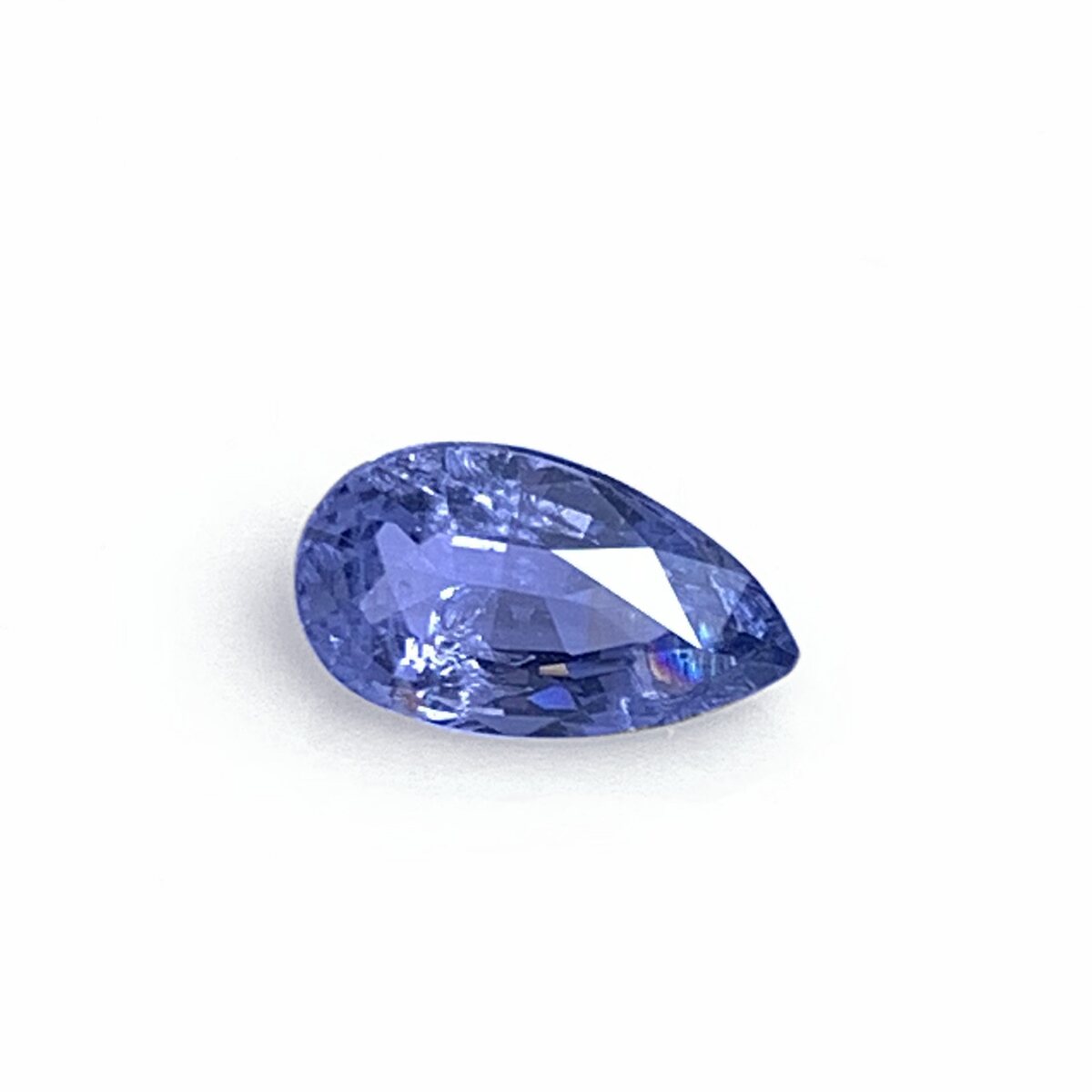 Natural pale blue spinel 0.60 ct from Luc Yen Vietnam, face up on white background