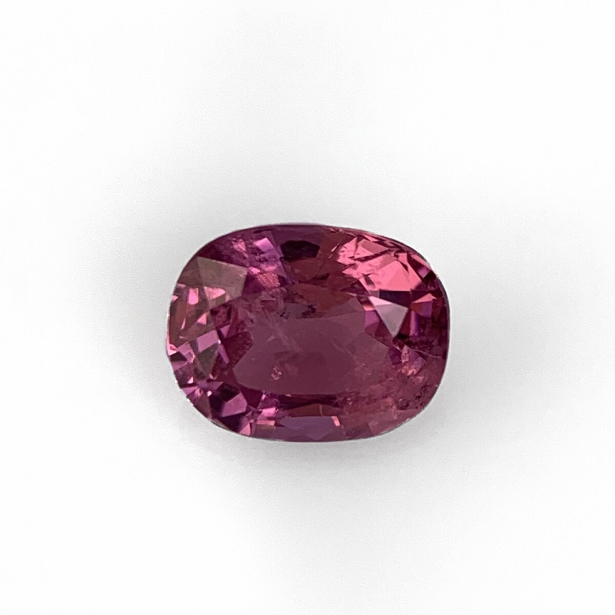 Natural purplish pink spinel 1.05 ct from Luc Yen Vietnam, face up on white background