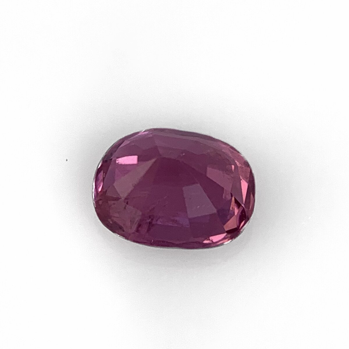 Natural purplish pink spinel, pavilion view on white background