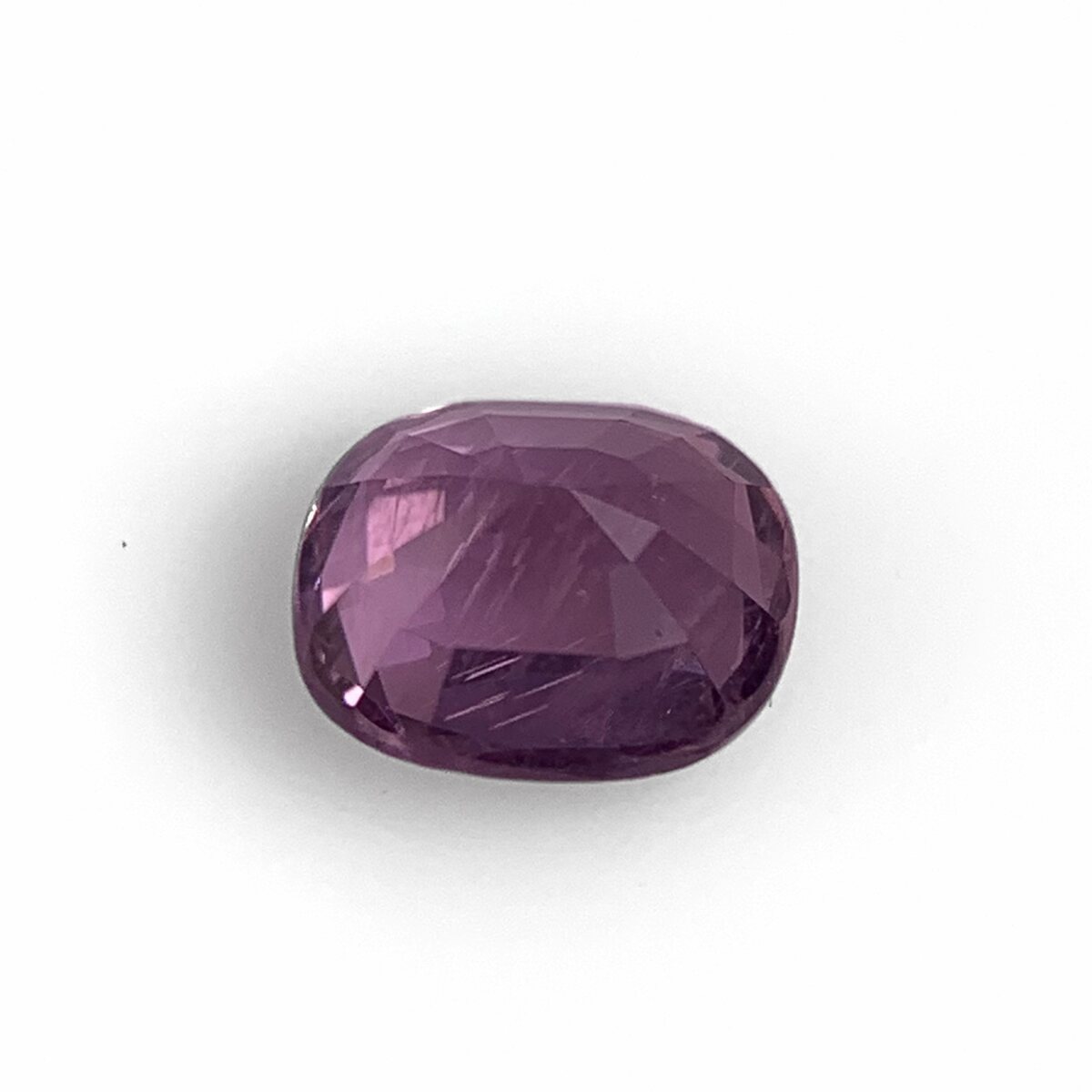 Natural purplish pink spinel, pavilion view on white background